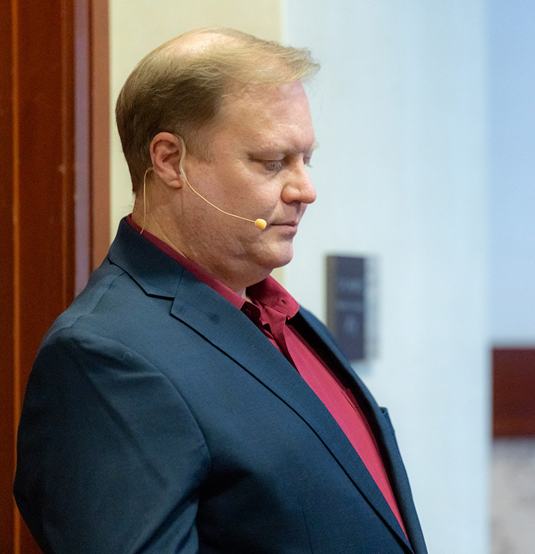 shy guy sitting and watching group talk