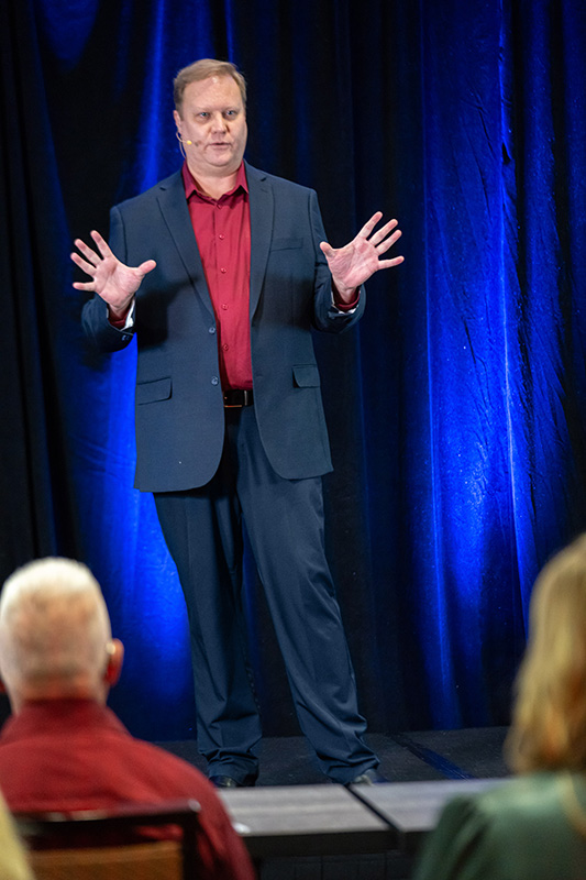 shy guy sitting and watching group talk