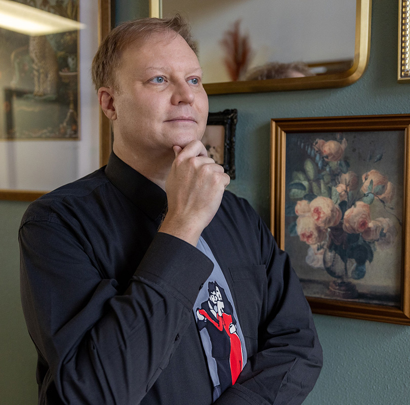 shy guy sitting and watching group talk